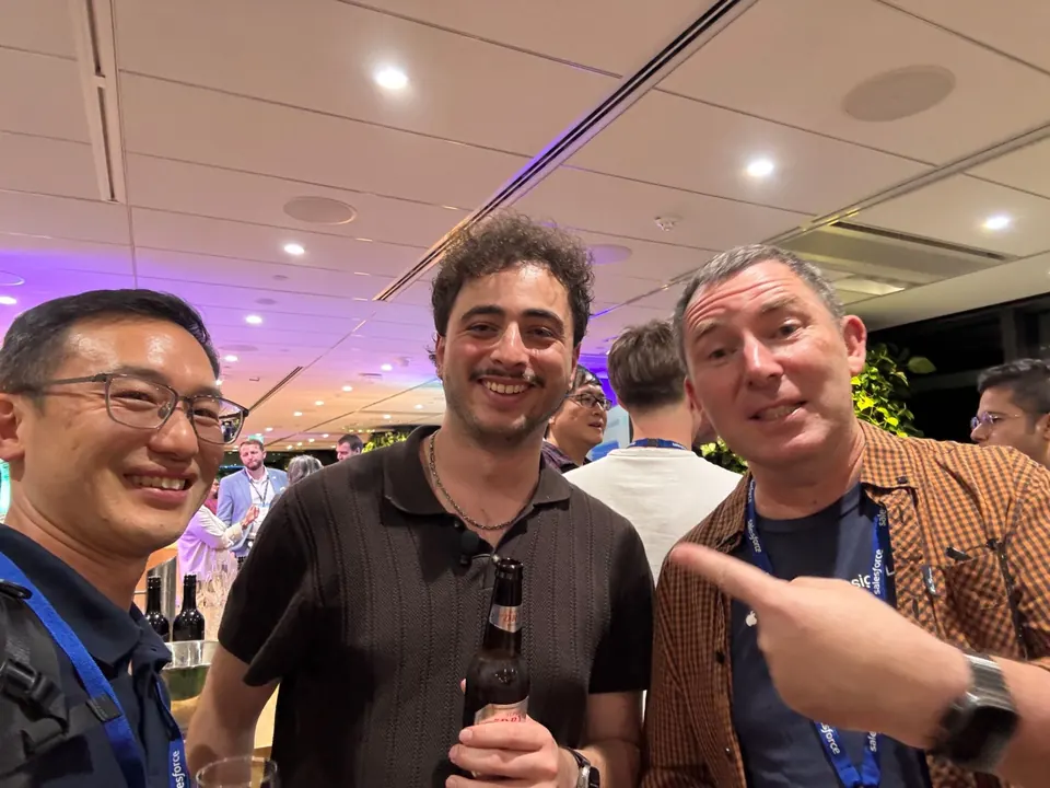 Three attendees posing for a selfie